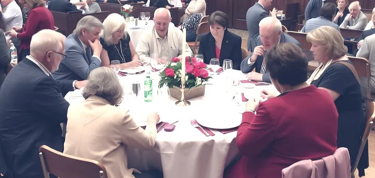 Church members sharing a meal together at a monthly luncheon